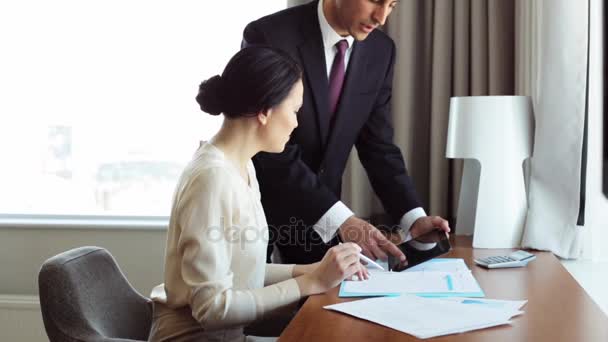 business team with papers and tablet pc at hotel - Footage, Video