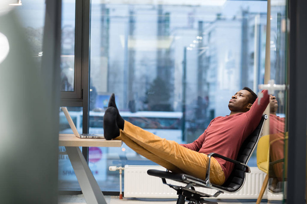 Young African American businessman in office - 写真・画像