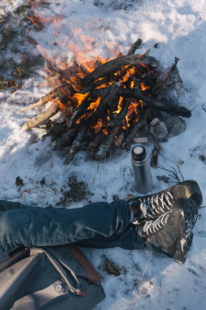 man near Bonfire on winter - 写真・画像