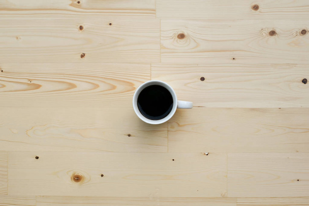 Cup of coffee on wooden background - Foto, Bild