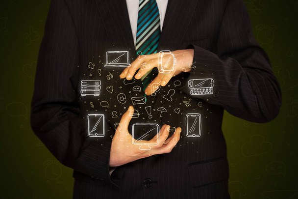 Businessman holding networking icons - Photo, Image