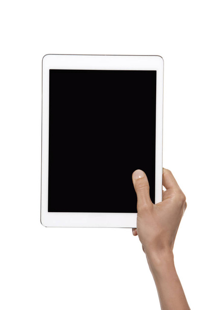Hand holding tablet over white background - Foto, Imagem