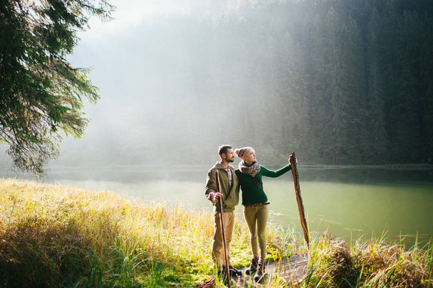 rustic couple walking in forest - Zdjęcie, obraz