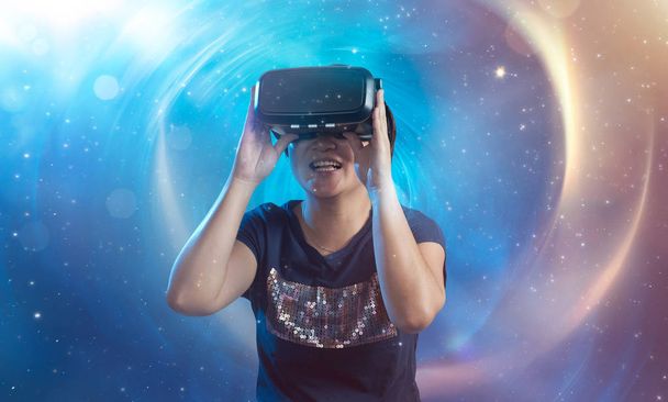 The woman wearing virtual reality goggles - Photo, image