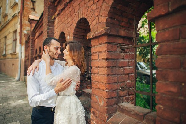 couple hugging near old building - Photo, image
