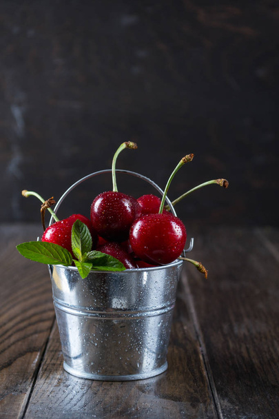 Cherrys in a decorative bucket - Photo, Image