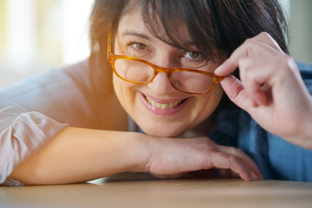 mature woman with eyeglasses on  - Фото, изображение