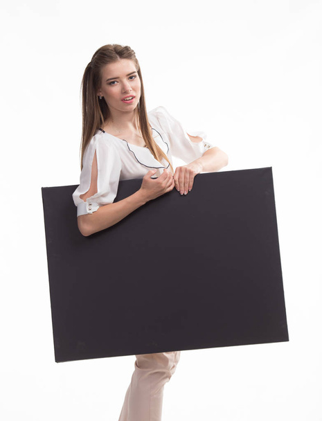 Young upset woman showing presentation, pointing on placard - Foto, Bild