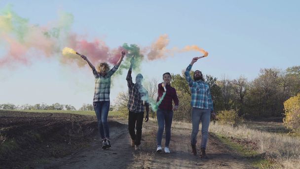 Youth with colored smoke grenades - Photo, image