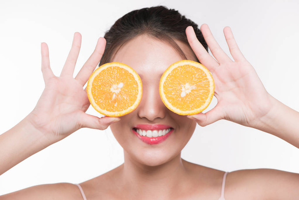 woman with orange slices - Фото, изображение