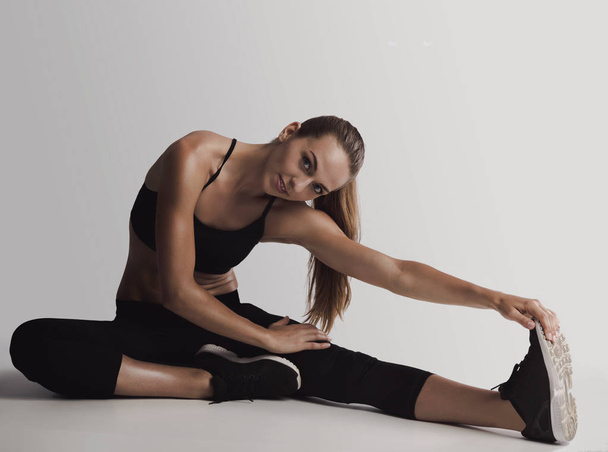  woman doing stretching exercises  - Zdjęcie, obraz