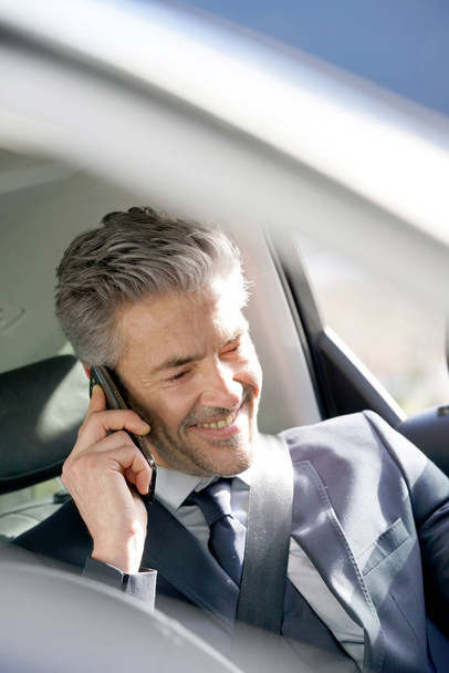 Businessman talking on phone  - Фото, зображення