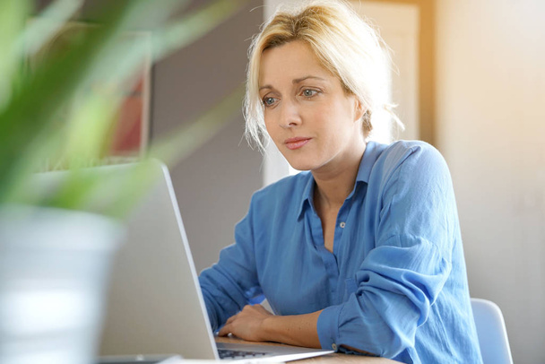  woman with blue shirt working - Photo, image