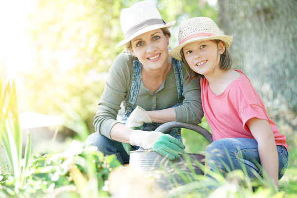 mother and daughter gardening together - Photo, image