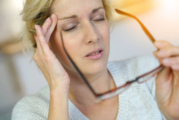  blond woman having a migraine - Foto, Imagen