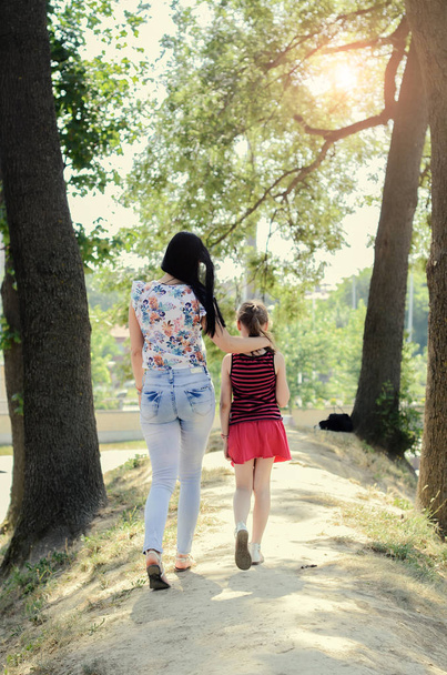 Mother and daughter walk  - Photo, image