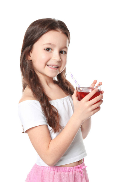Cute little girl with glass of juice - Фото, изображение
