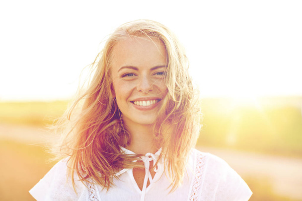 close up of happy young woman in white outdoors - Foto, Imagen
