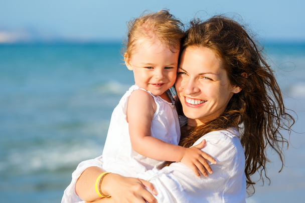 Mother and daughter on the beach - Photo, Image