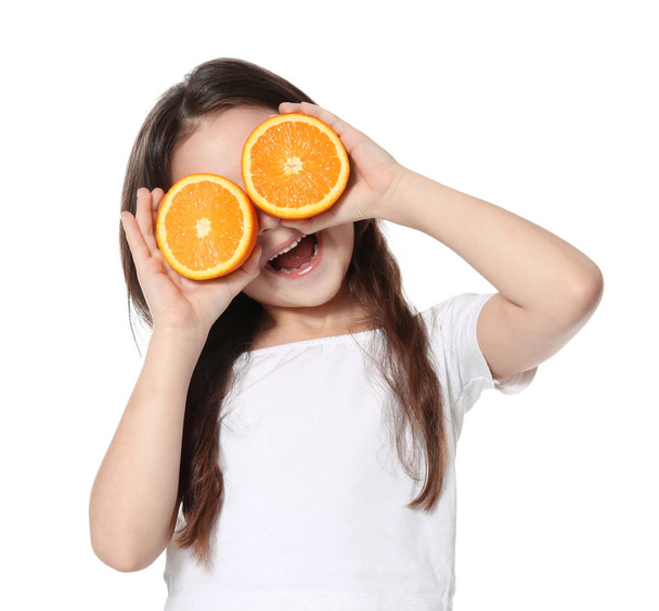 Cute little girl with halves of orange - Fotografie, Obrázek