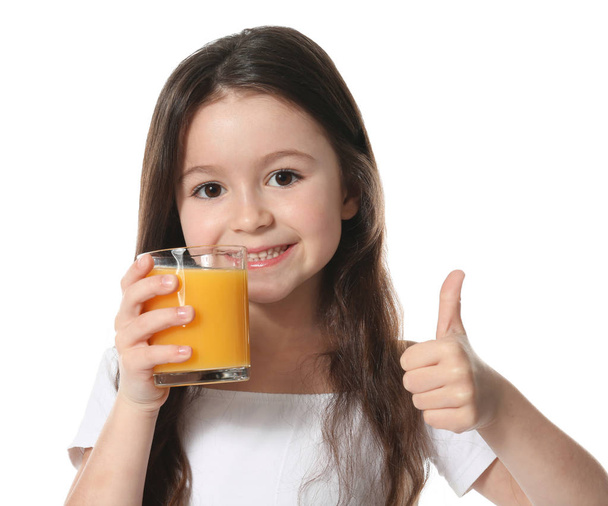 Cute little girl with glass of juice - Valokuva, kuva