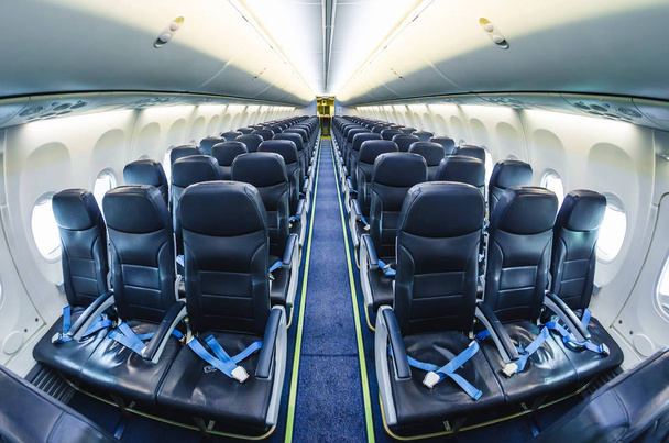 Vista luminosa interior do avião nos bancos dos passageiros
. - Foto, Imagem