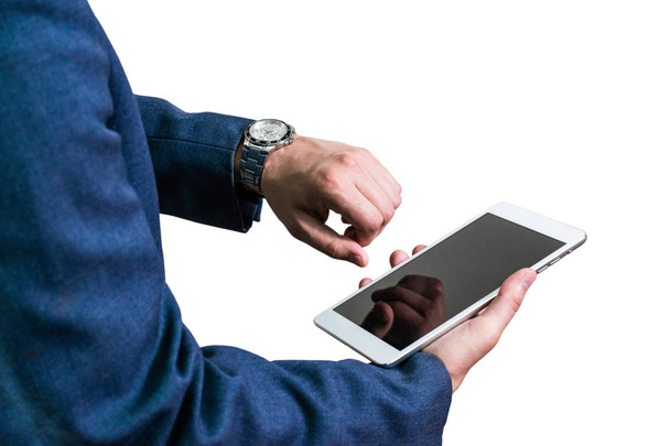 Businessman in a jacket holding a tablet - Valokuva, kuva