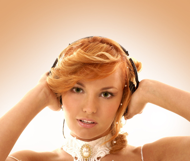 Sexy redhead listening to the music - Fotó, kép