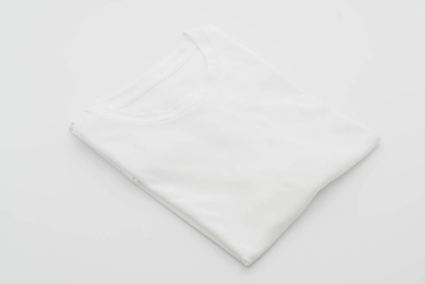 shirt. folded t-shirt on white  - Фото, изображение