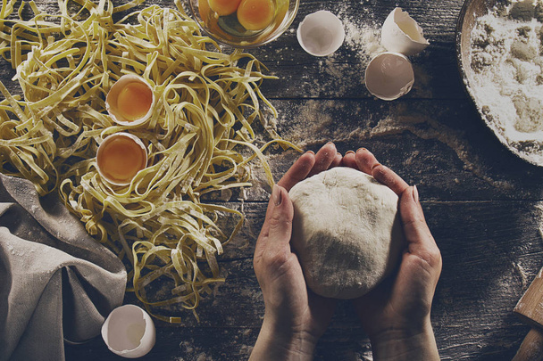Woman cook hands preparing making tasty homemade classic italian pasta - Photo, Image