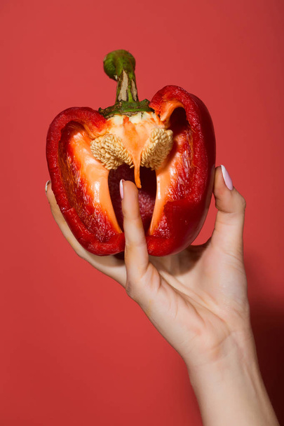 heart concept, hand of woman hold sweet bell pepper - Fotó, kép