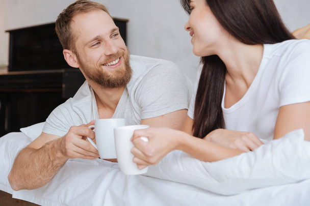 Adorable couple having breakfast in bed - Photo, image