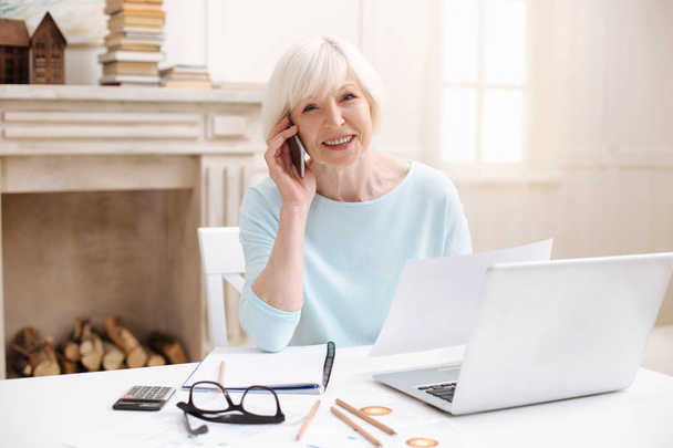 Ambitious elderly lady managing the project from home - Foto, Imagen