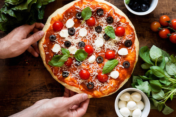 Italian pizza on wooden table - Photo, Image