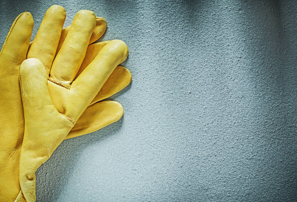 Leather protective gloves on concrete surface construction conce - 写真・画像
