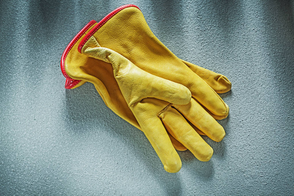 Leather working gloves on concrete background construction conce - Фото, изображение