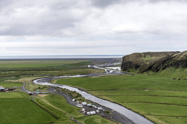 View from Skogafoss beautiful green Iceland - 写真・画像