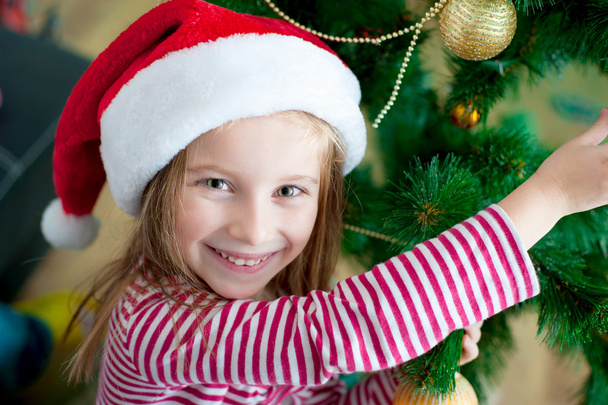 Little girl with santa hat - Foto, Imagem