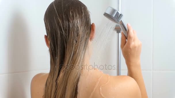 Slow motion footage of sexy woman washing neck and shoulders at shower - Video