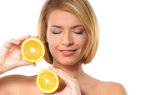 Portrait oy young and healthy woman with orange - Foto, Imagen