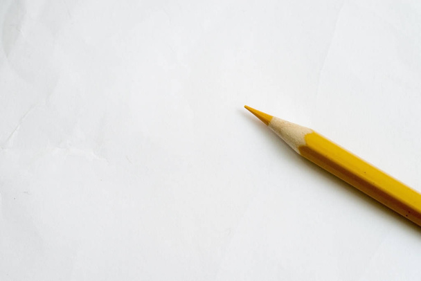 Pencil yellow on white paper - Zdjęcie, obraz