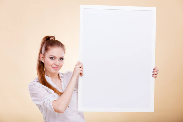 Girl with blank presentation board - Фото, изображение