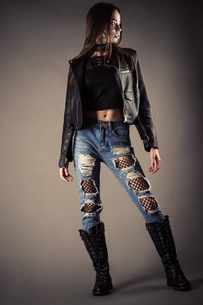 beautiful fashionable teenager girl in leather jacket and torn jeans - Foto, immagini