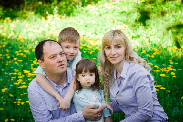 Family portrait in a spring park.  - Valokuva, kuva