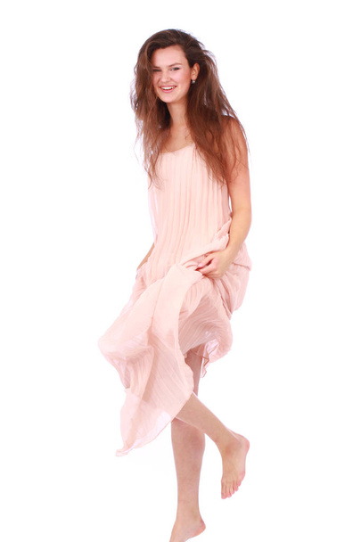 Happy woman in light pink dress isolated on white - Foto, Imagen