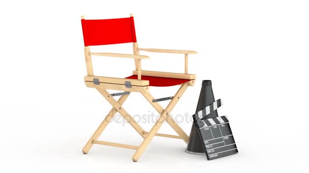 Kino-Industrie-Konzept. Roter Regiestuhl, Filmklöppel und Megafon - Filmmaterial, Video