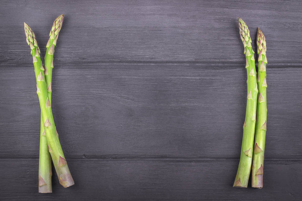 Fresh asparagus on wooden rustic background. Copy space - Foto, immagini
