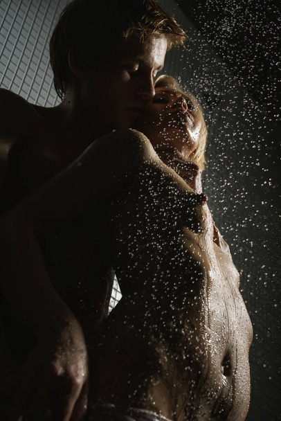 Passionate couple having sex in shower studio shot - Photo, image