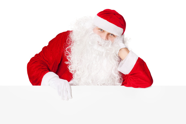 Santa Claus támaszkodva üres fedélzeten elszigetelt fehér background - Fotó, kép