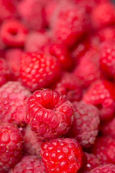 Fresh raspberries background closeup photo - Фото, изображение